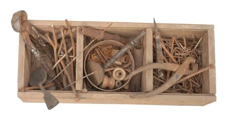 Antique rusty tools on an old wooden desk の写真素材