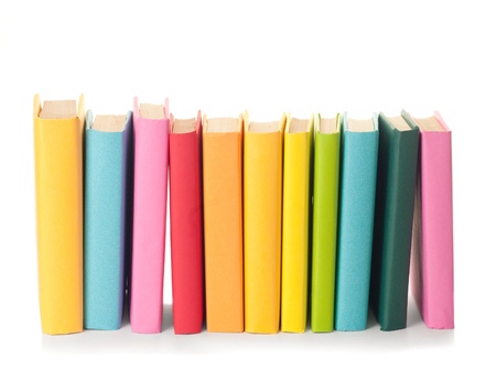 close up of stack of colorful books on white backgroundの写真素材