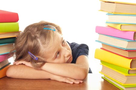 A young girl not happy about studying の写真素材