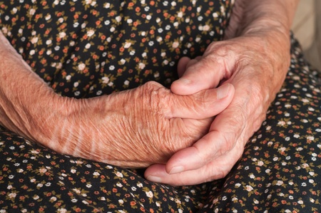 Closeup of a senior woman's hands togetherの写真素材
