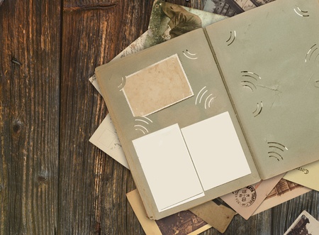 the old album on wooden background