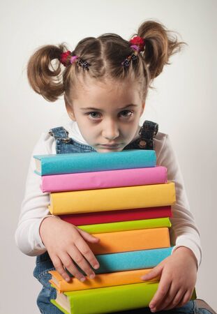 sad girl with books の写真素材