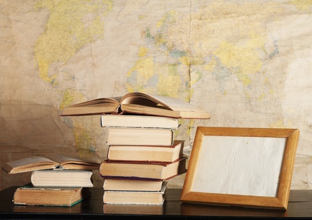 a pile of books on the background mapの写真素材