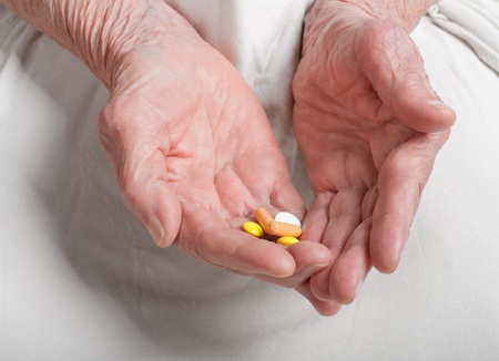 pill on the hands of old woman の写真素材