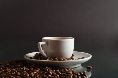 cup of coffee with grains on a black background の写真素材