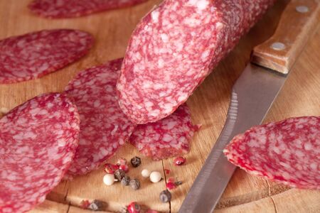 salami close up on a wood board の写真素材