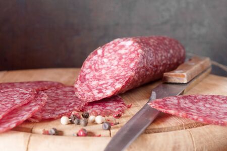 salami close up on a wood board の写真素材