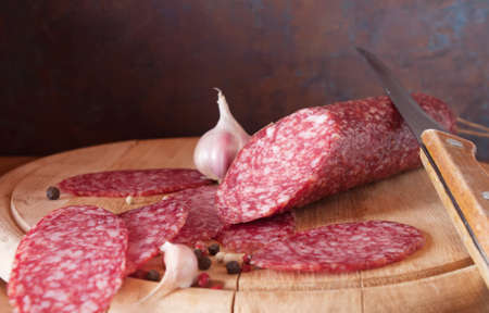 salami close up on a wood board の写真素材