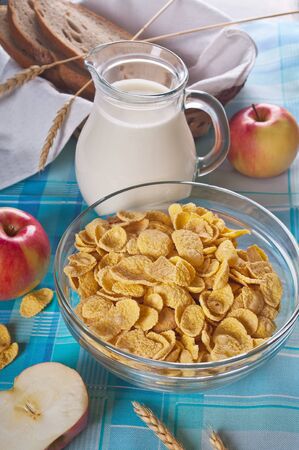 healthy breakfast  cornflakes with milk and  apples の写真素材