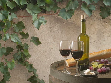 Red wine glass on vintage a background の写真素材