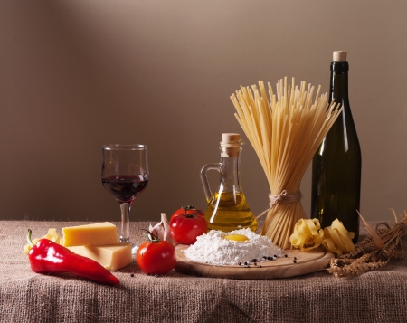 still life with pasta, vegetables and wineの写真素材