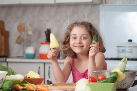 child  preparing healthy food vegetable saladの写真素材
