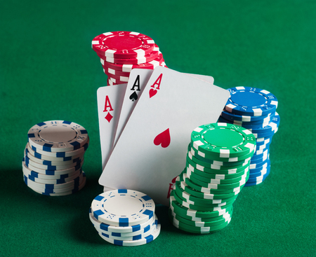 Poker chips on green  background