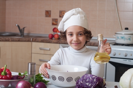 girl preparing healthy food vegetable saladの写真素材