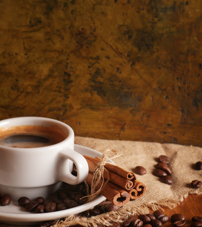 Coffee cup with burlap sack on wooden tableの写真素材