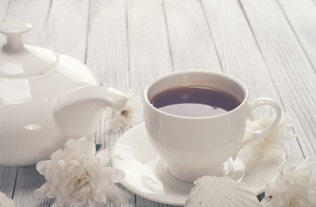 Tea cup served on wooden tableの写真素材