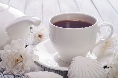 Tea cup served on wooden tableの写真素材