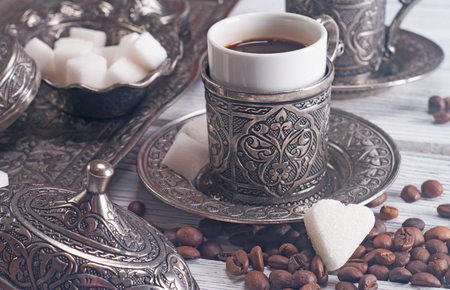 Turkish coffee with traditional embossed metal tray and cupの写真素材