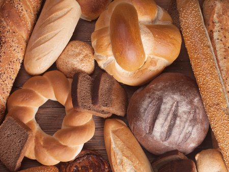 different types of bread on a wooden table