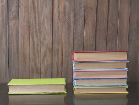 Books on a wooden background.の写真素材