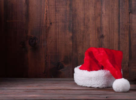 Santa hats on a wooden backgroundの写真素材