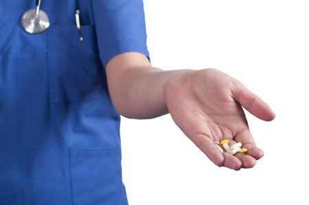 Doctor's hands holding  pillsの写真素材