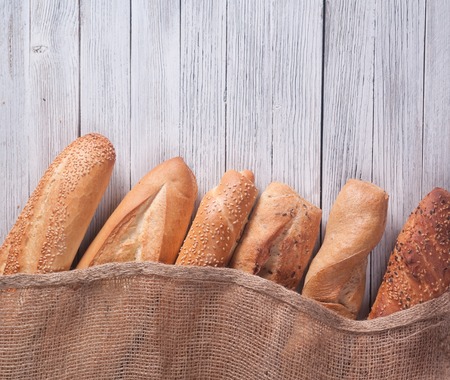different types of baguette on a wooden backgroundの写真素材