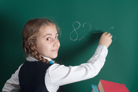 schoolgirl and school boardの写真素材