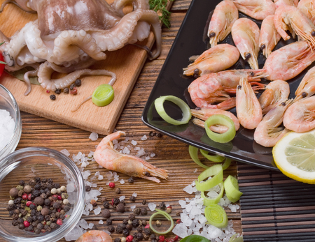 seafood and vegetables on a wooden backgroundの写真素材