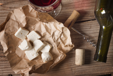 snack and wine on a wooden tableの写真素材