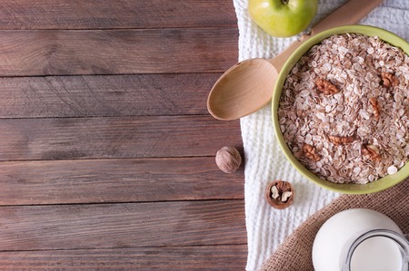 Lifestyle photo of healthy breakfast with oat-flakes and milkの写真素材
