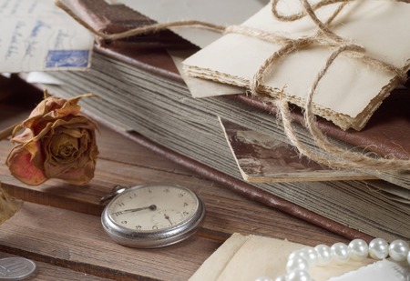 old photos and letters on the wooden tableの写真素材