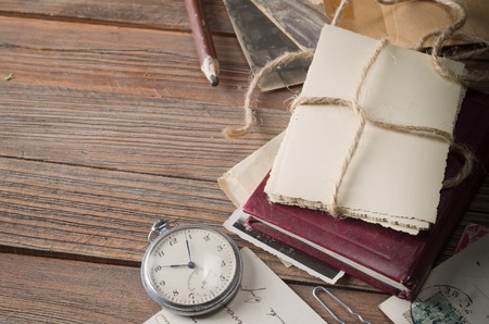 old photos and letters on the wooden tableの写真素材