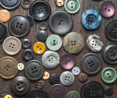 vintage buttons on old wooden table