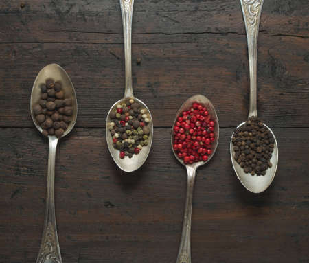 various types of pepper on a wooden backgroundの写真素材