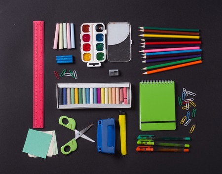 School supplies on blackboard backgroundの写真素材
