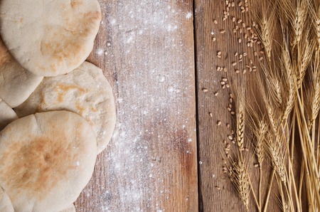 pita bread on a wooden backgroundの写真素材
