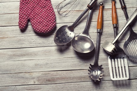 various kitchen utensils on wooden tableの写真素材