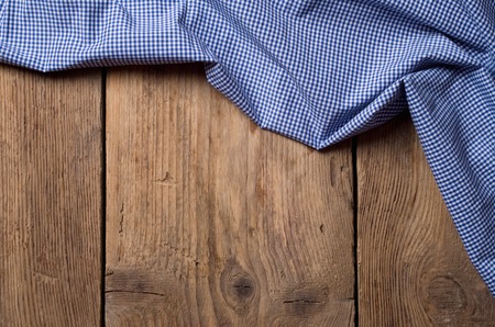old wooden table with tablecloth backgroundの写真素材