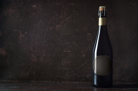 wall and champagne on wooden tableの写真素材