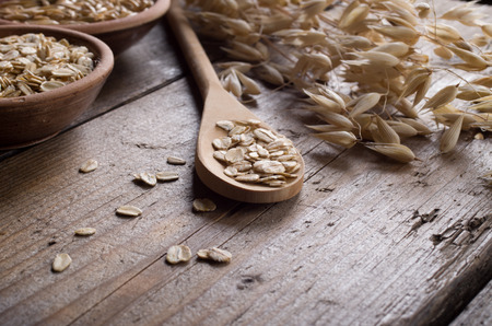 oat flakes on the old boardの写真素材