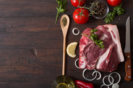 fresh raw meat prepared for cooking on woodの写真素材