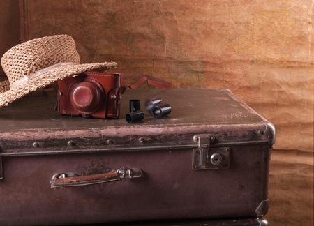 Old suitcase with a cameraの写真素材