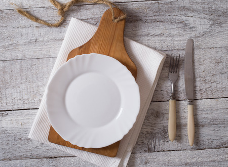 Empty plate on wooden tableの写真素材