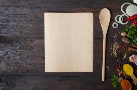 Herbs and spices with a recipe book の写真素材
