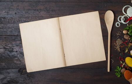Herbs and spices with a recipe bookの写真素材