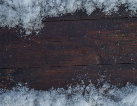 Old wood texture with snow flakes