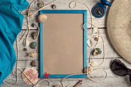 frame and sea shells on wood backgroundの写真素材