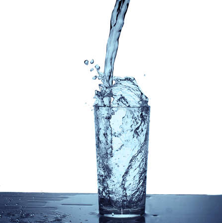 Water splash with drops from a glass
