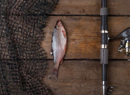Fishing tackle on wooden backgroundの写真素材